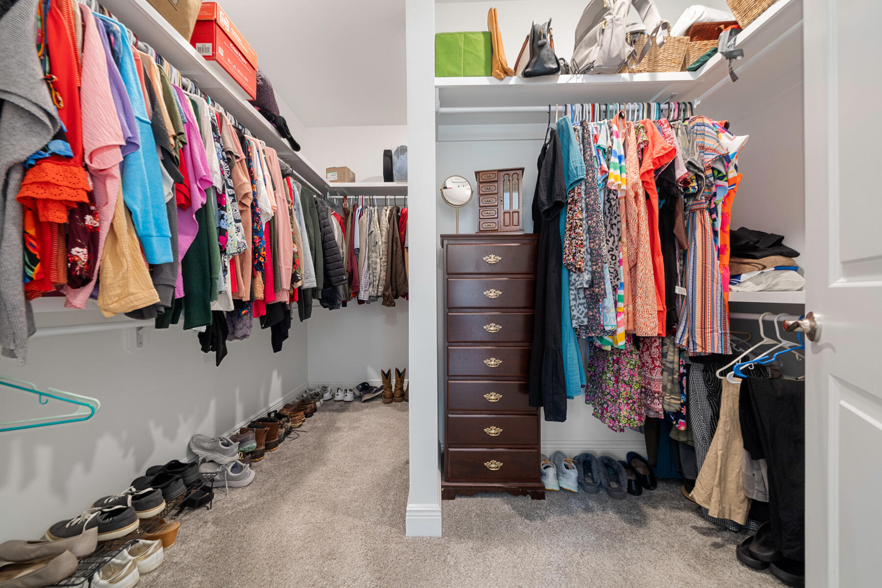 301 Mill Pond Cove Freeport, FL 32439 - Photo 39 of 55 a view of walk in closet with clothes and shoes