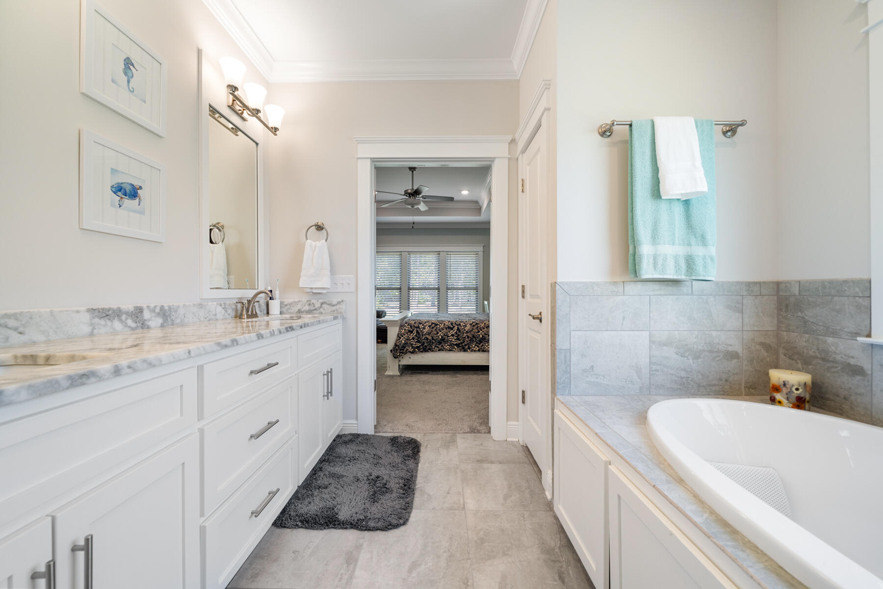 301 Mill Pond Cove Freeport, FL 32439 - Photo 40 of 55 a en suite bathroom with a granite countertop tub and a sink