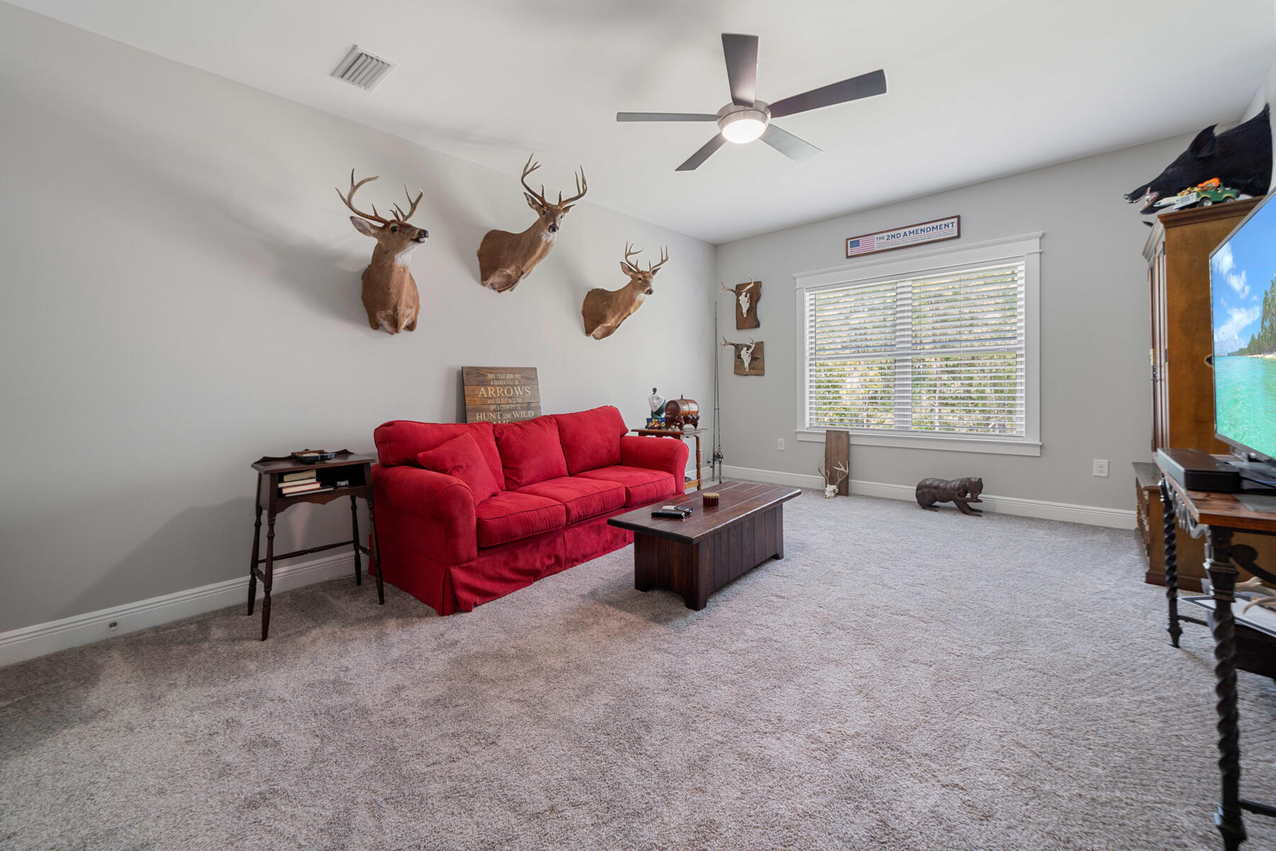 301 Mill Pond Cove Freeport, FL 32439 - Photo 45 of 55 a living room with furniture and a flat screen tv