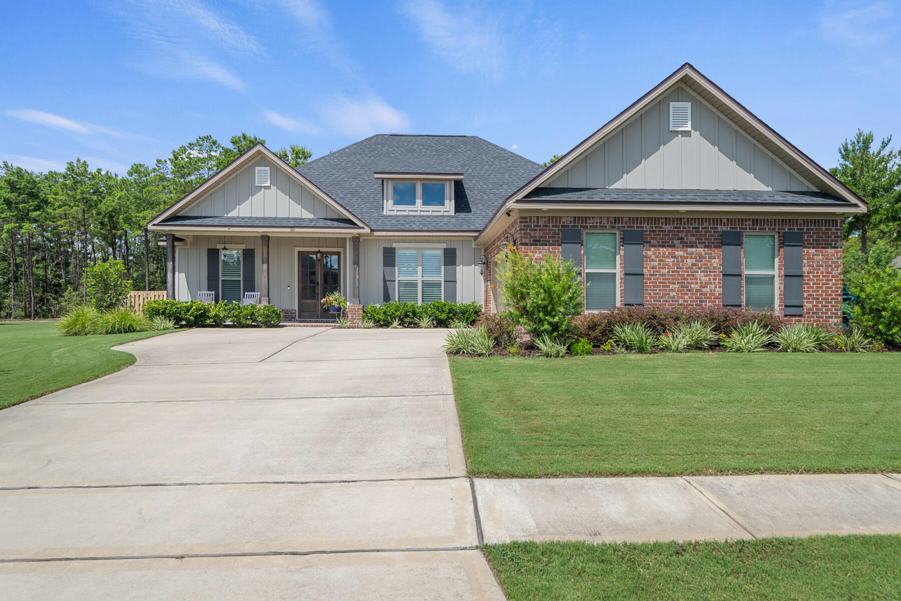 301 Mill Pond Cove Freeport, FL 32439 - Photo 5 of 55 a front view of a house with a yard