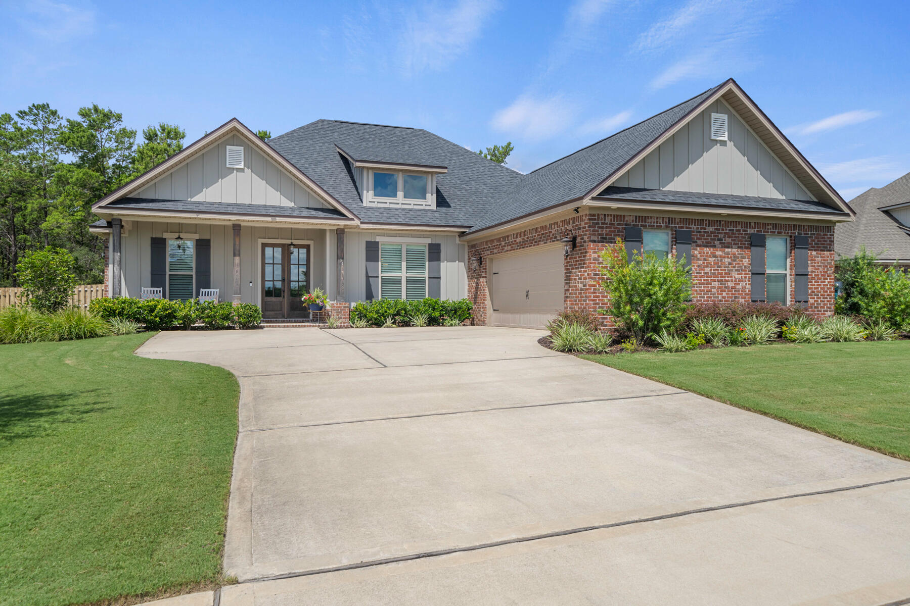301 Mill Pond Cove Freeport, FL 32439 - Photo 7 of 55 a front view of a house with a yard
