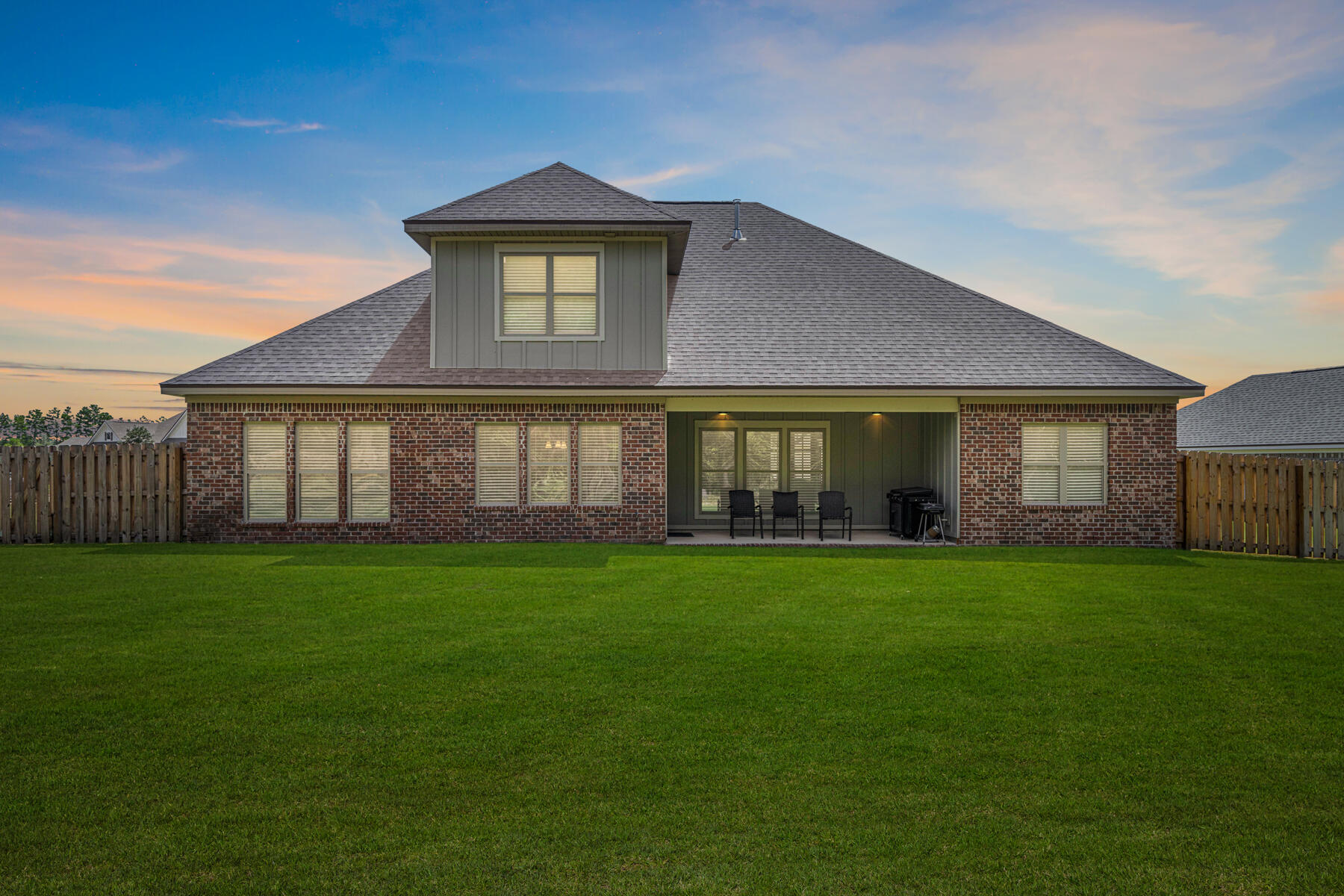 301 Mill Pond Cove Freeport, FL 32439 - Photo 10 of 55 a front view of a house with a garden