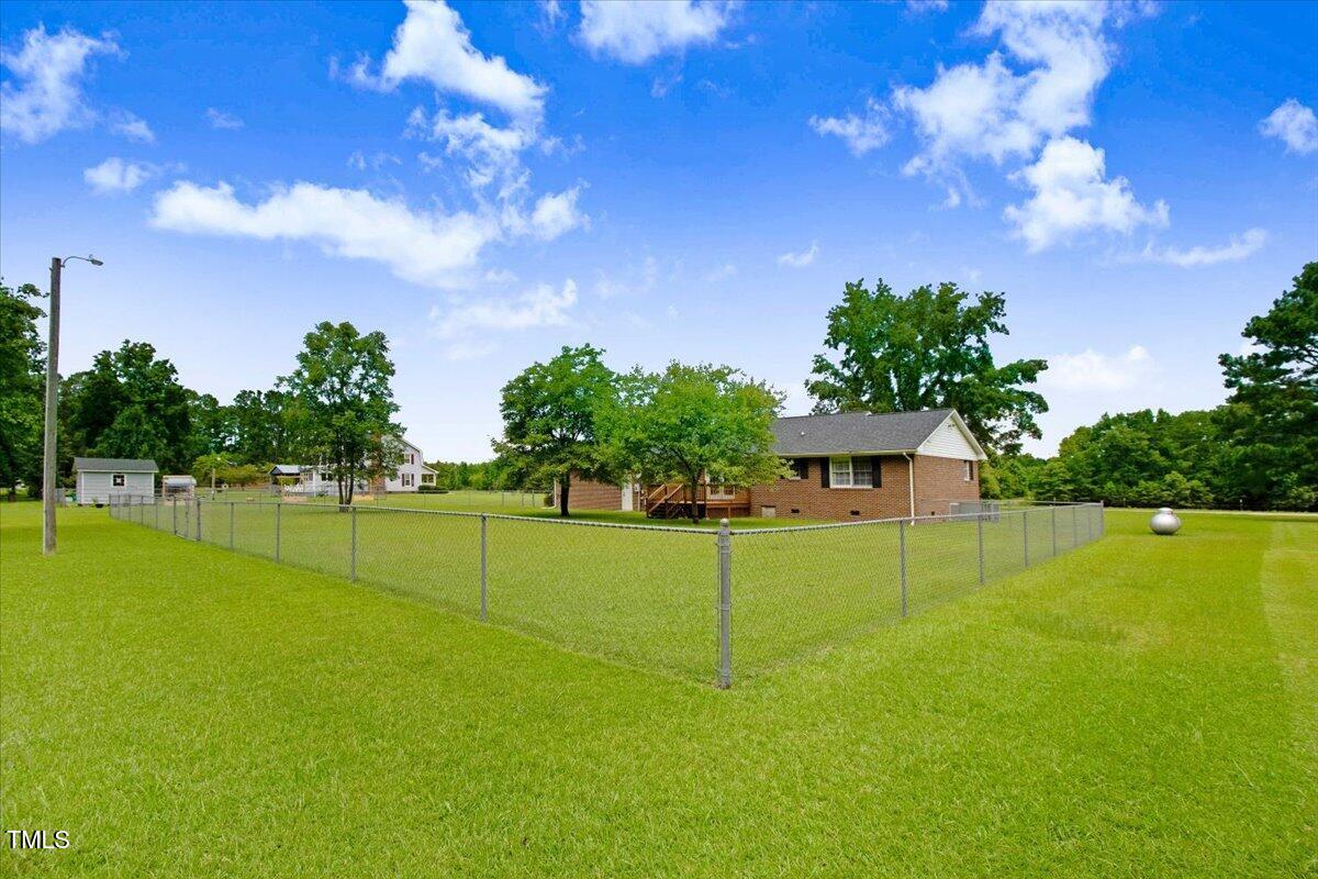 1860 Little Devine Road Selma, NC 27576 - Photo 32 of 46 fenced backyard area