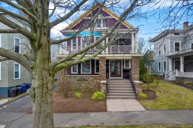 a front view of a house with garden