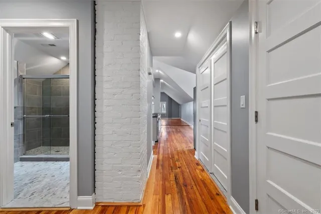 a bathroom with a shower and a mirror