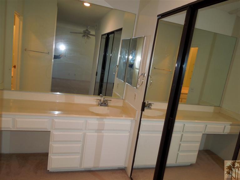 71948 Eleanora Lane Rancho Mirage, CA 92270 - Photo 12 of 15 a bathroom with a sink a mirror and shower