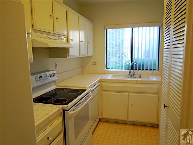 71948 Eleanora Lane Rancho Mirage, CA 92270 - Photo 5 of 15 a kitchen with a sink a stove and cabinets