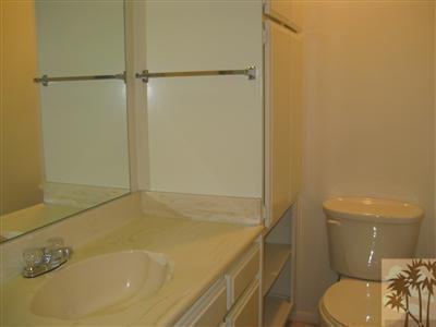 71948 Eleanora Lane Rancho Mirage, CA 92270 - Photo 6 of 15 a bathroom with a granite countertop sink toilet and shower