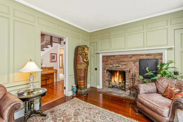 a view of entryway livingroom and hall with wooden floor