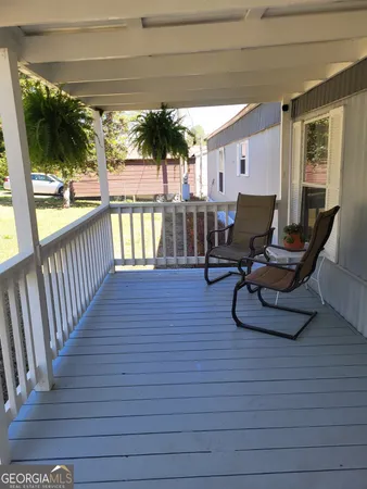 a view of a floor to ceiling window and wooden floor