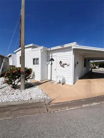 a couple of cars parked in front of a house
