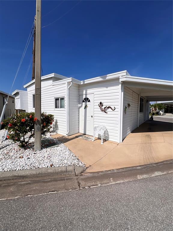 72 4th Avenue, Unit 72 Venice, FL 34285 - Photo 1 of 29 a couple of cars parked in front of a house