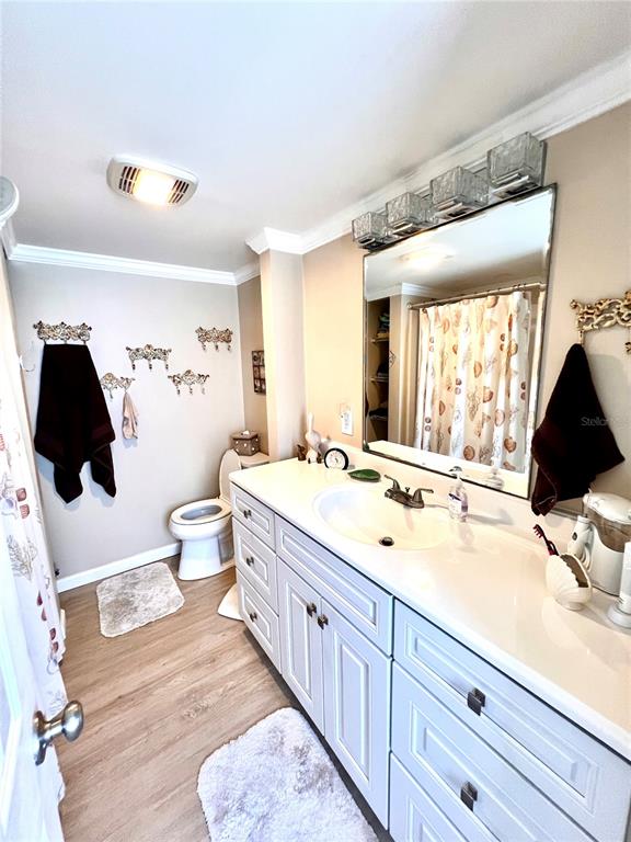 72 4th Avenue, Unit 72 Venice, FL 34285 - Photo 11 of 29 a spacious bathroom with a double vanity sink toilet mirror and window