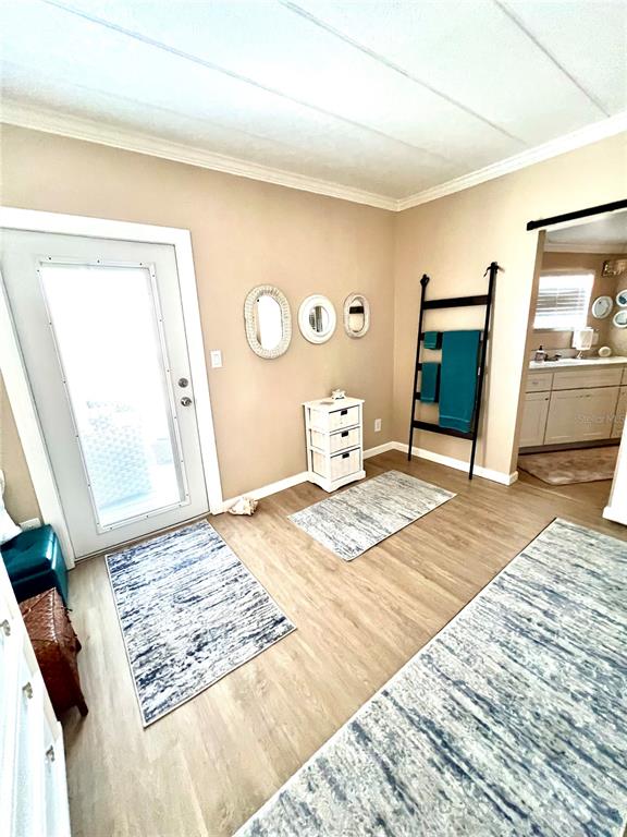 72 4th Avenue, Unit 72 Venice, FL 34285 - Photo 12 of 29 a bedroom with a bed and a mirror on the dresser