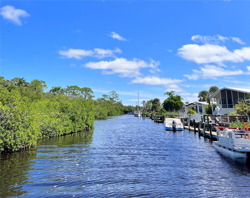 72 4th Avenue, Unit 72 Venice, FL 34285 - Photo 22 of 29 a view of a lake with outdoor seating