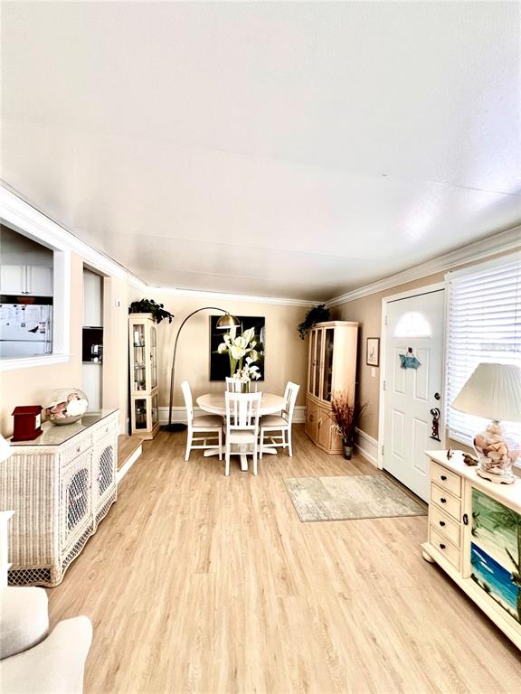 72 4th Avenue, Unit 72 Venice, FL 34285 - Photo 6 of 29 a living room with furniture and a wooden floor