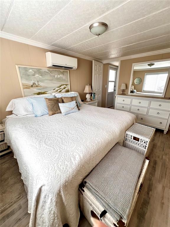 72 4th Avenue, Unit 72 Venice, FL 34285 - Photo 9 of 29 a large bedroom with a bed and window