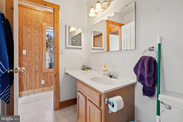 a kitchen with stainless steel appliances a refrigerator sink stove and cabinets