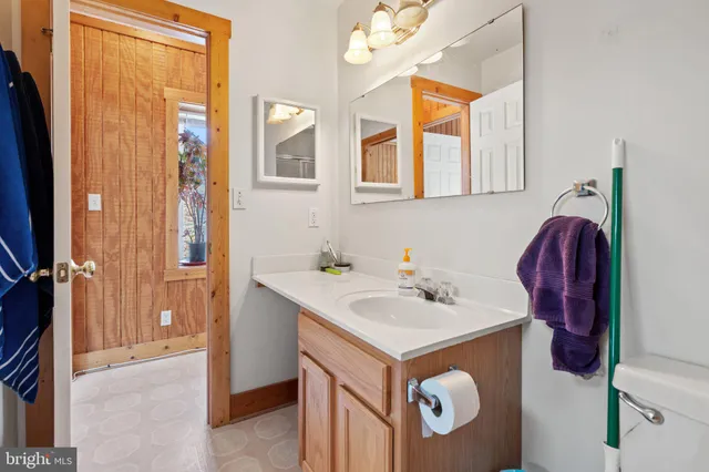 a kitchen with stainless steel appliances a refrigerator sink stove and cabinets