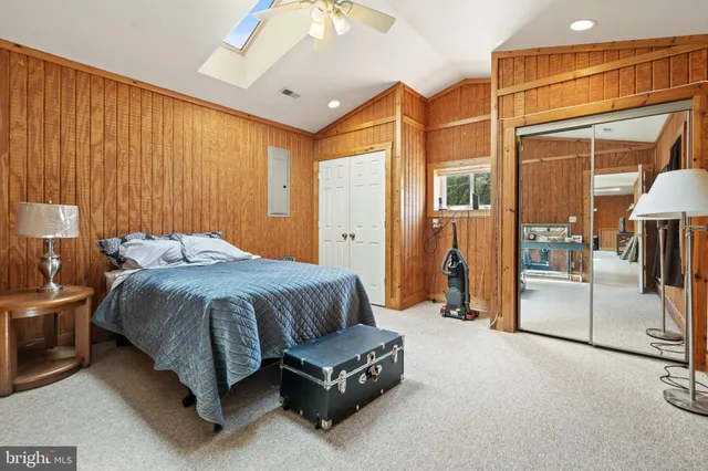 a kitchen with refrigerator and cabinets