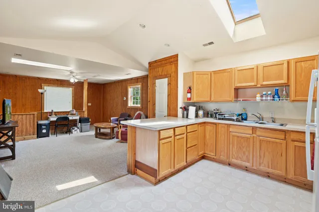 a view of entryway with wooden floor and stairs