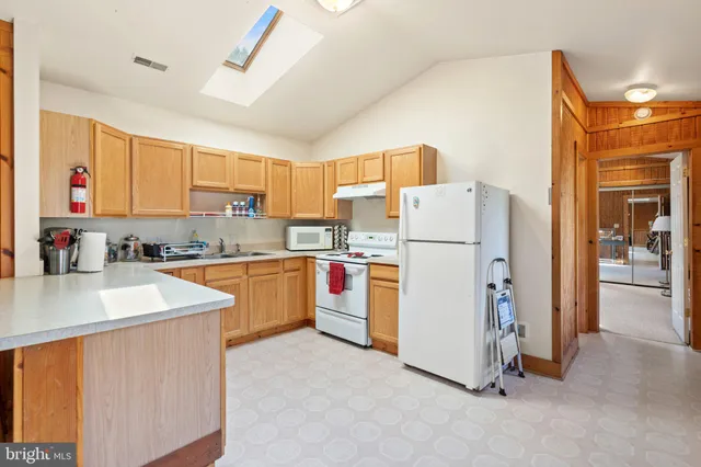 a room with furniture and a gym machine