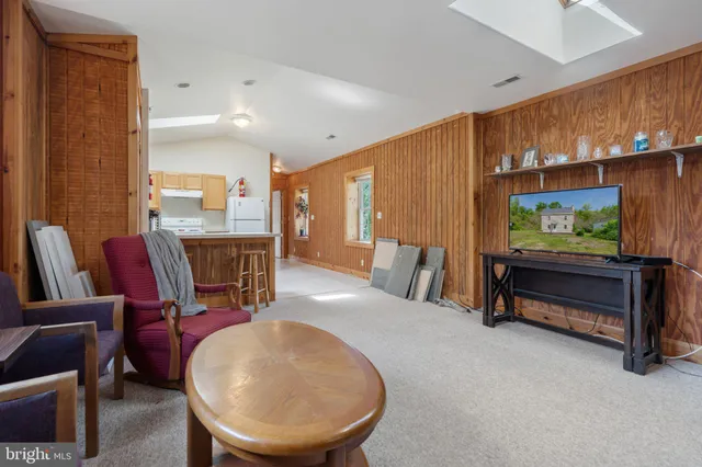 a bedroom with two beds and a window
