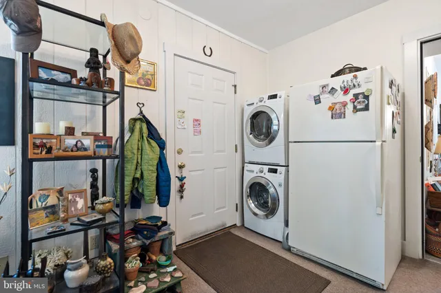 a kitchen with a table and chairs in it