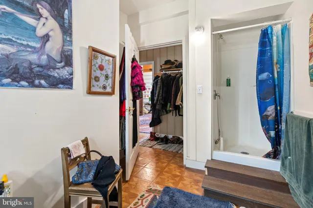 a living room with lots of furniture and a rug