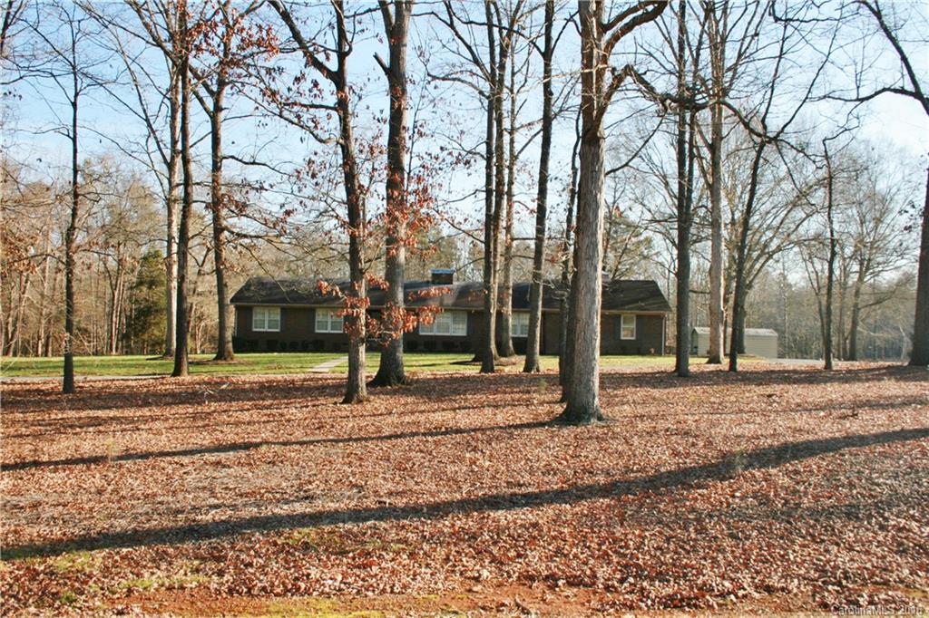 2512 Old Camden Road Monroe, NC 28110 - Photo 3 of 23 a house with trees in front of it