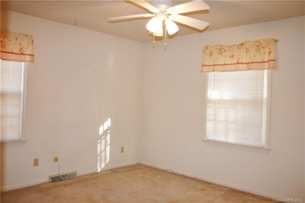 2512 Old Camden Road Monroe, NC 28110 - Photo 22 of 23 an empty room with a window and a fan