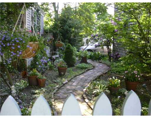209 Spring Street Newport, RI 02840 - Photo 4 of 12 Yard/Garden. Side yard provides just enough space to enjoy gardening. A relaxing retreat!