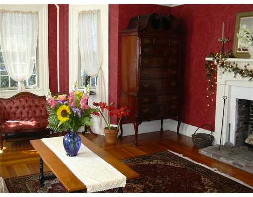 209 Spring Street Newport, RI 02840 - Photo 5 of 12 Living Room. Spacious living room with window bay and wood burning fireplace.