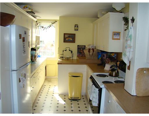 209 Spring Street Newport, RI 02840 - Photo 8 of 12 Kitchen. Back door and stairs to basement beyond.