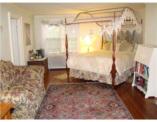 209 Spring Street Newport, RI 02840 - Photo 9 of 12 Master Bedroom. Plenty of space for sitting area in front of fireplace. Private bath and walk-in dressing area to left.