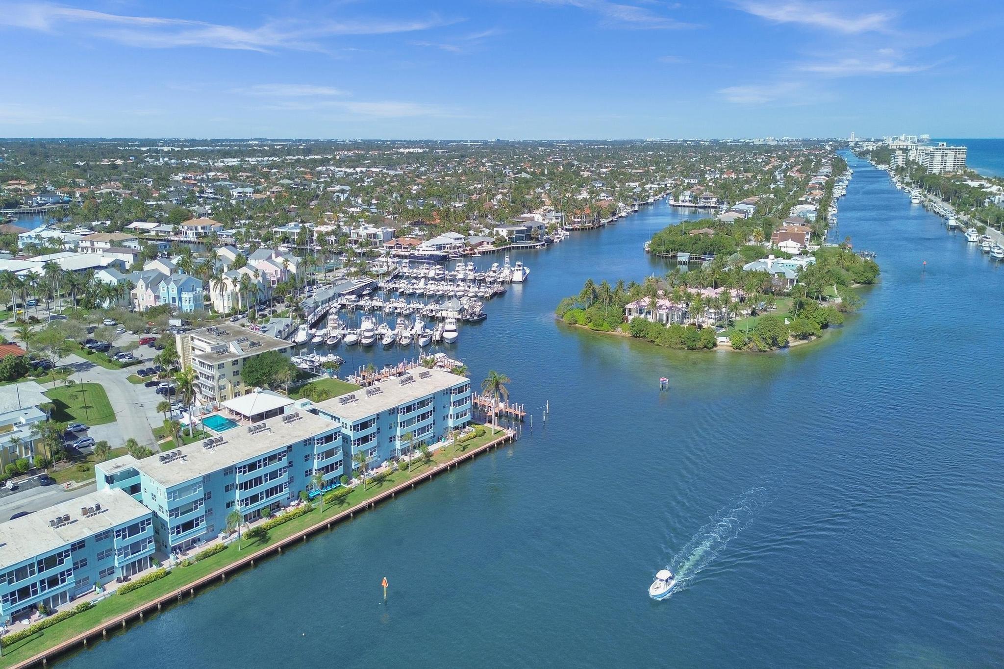 2772 Northeast 30th Avenue, Unit 6C Lighthouse Point, FL 33064 - Photo 1 of 16 an aerial view of residential houses with outdoor space