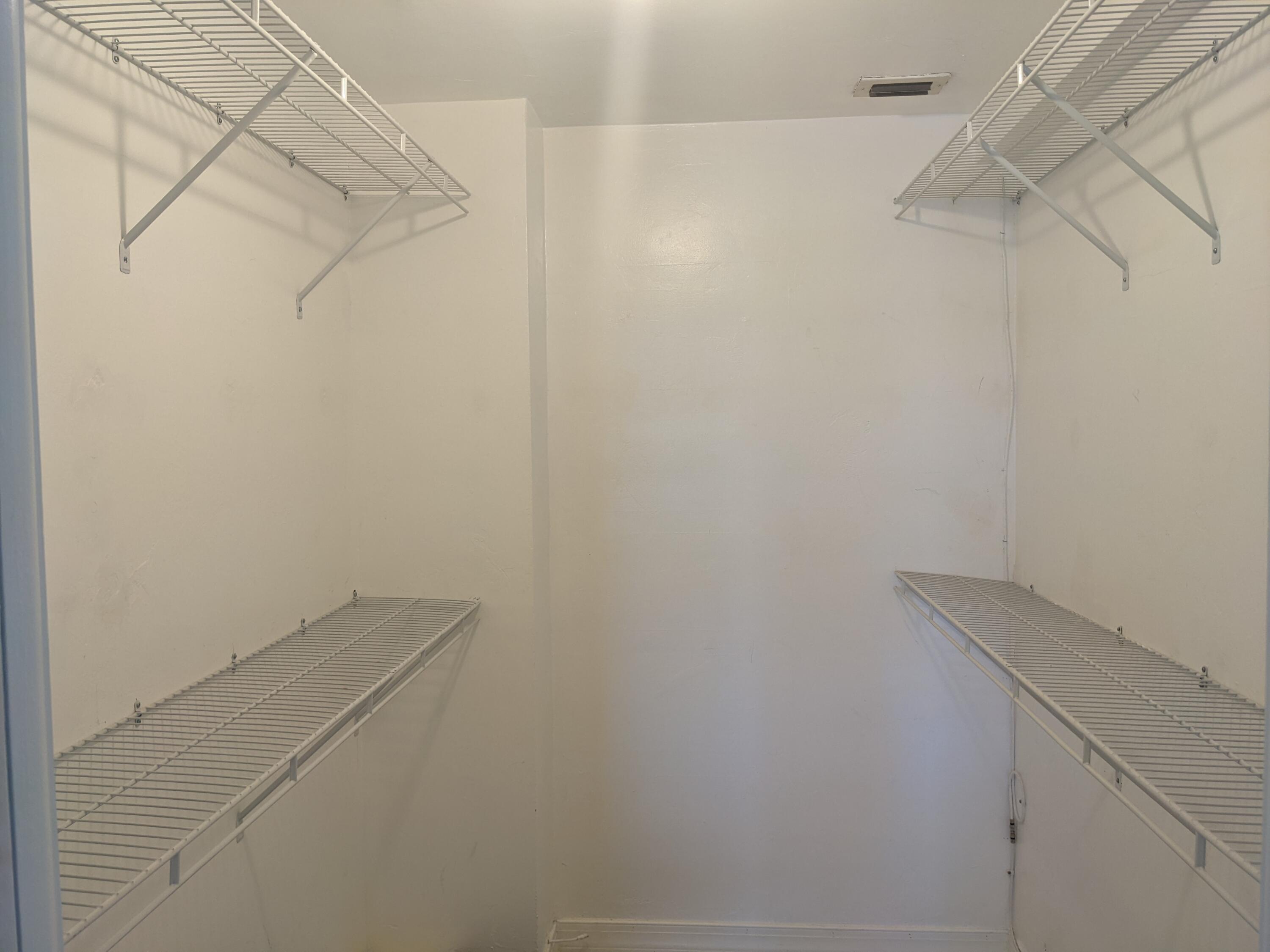 2772 Northeast 30th Avenue, Unit 6C Lighthouse Point, FL 33064 - Photo 15 of 16 a view of small space with racks on the wall