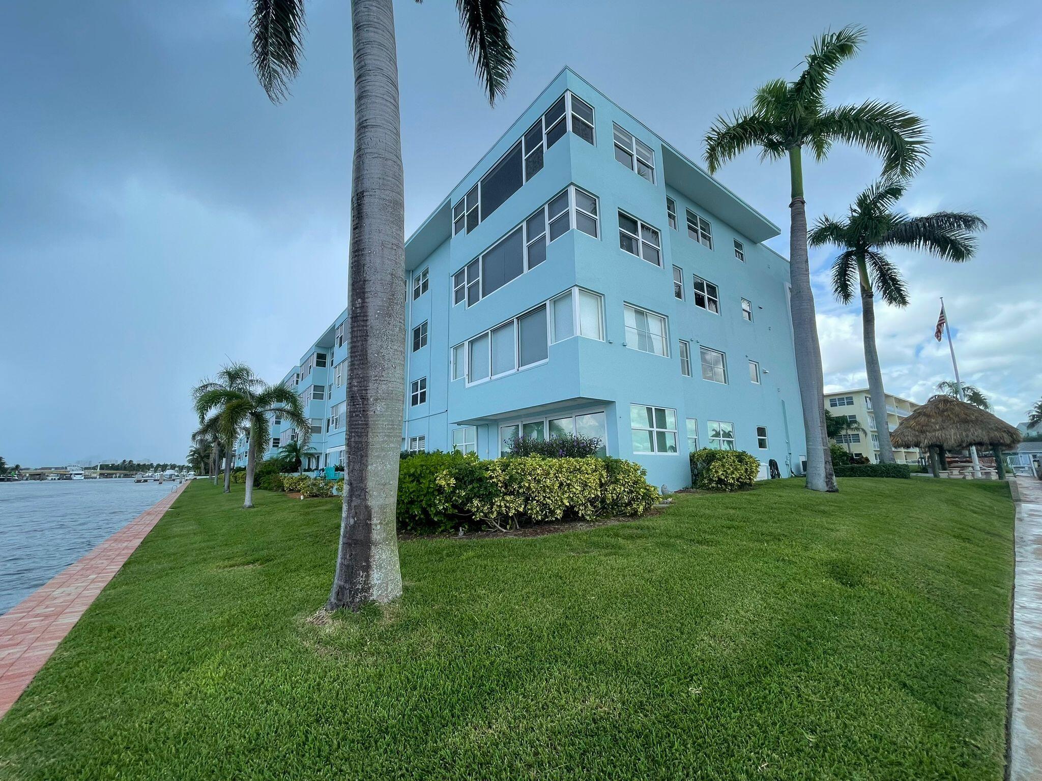 2772 Northeast 30th Avenue, Unit 6C Lighthouse Point, FL 33064 - Photo 4 of 16 a view of a building with garden