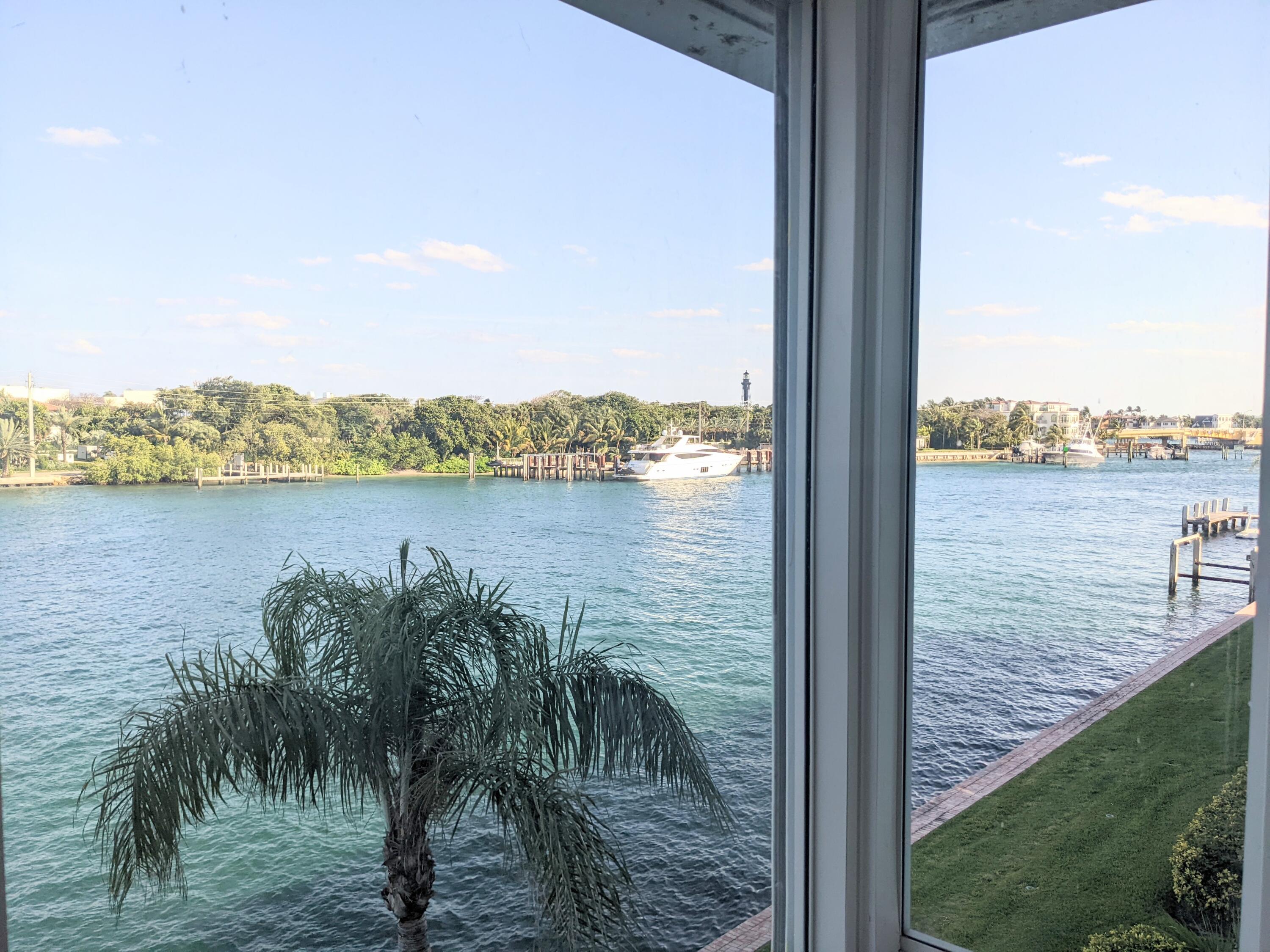 2772 Northeast 30th Avenue, Unit 6C Lighthouse Point, FL 33064 - Photo 10 of 16 a view of a lake from a balcony