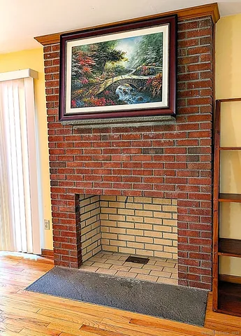 a view of a door and brick walls