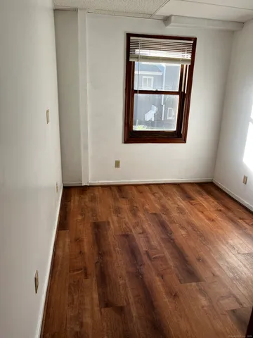 a bathroom with a toilet a sink and a mirror