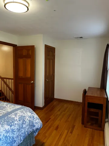 a view of a fireplace with wooden floor