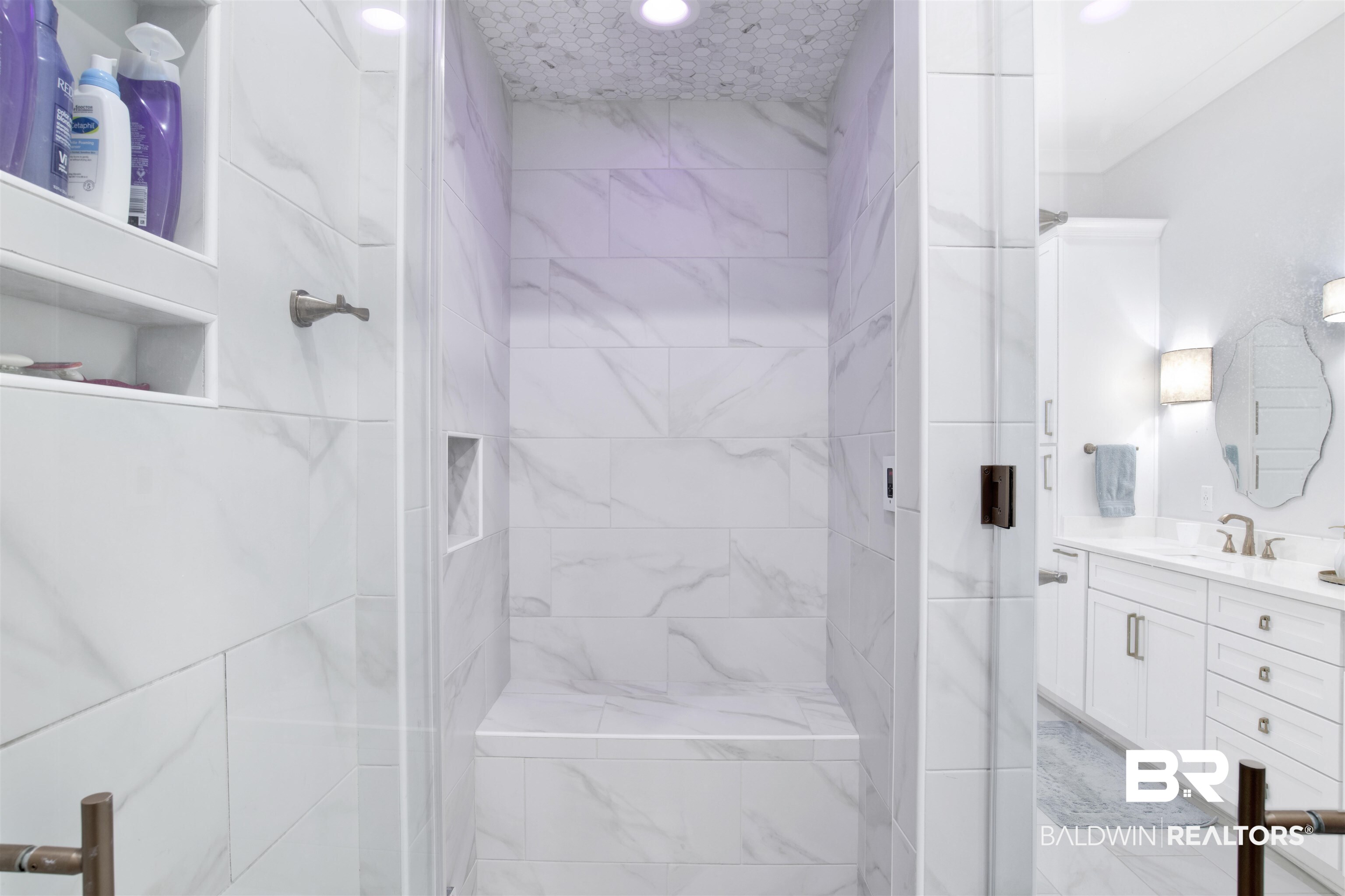 32937 River Road Orange Beach, AL 36561 - Photo 21 of 42 Bathroom featuring vanity and a shower with shower door