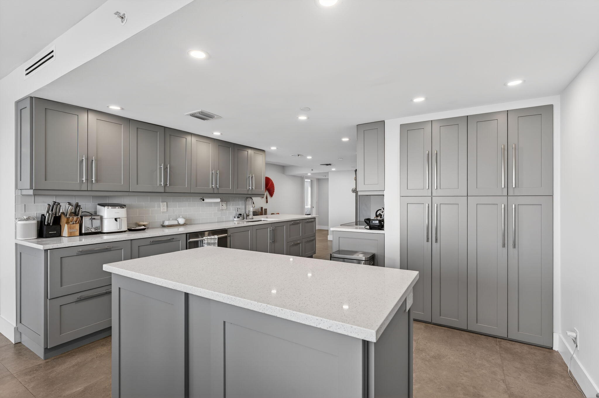 4301 North Ocean Boulevard, Unit 1206 Boca Raton, FL 33431 - Photo 12 of 71 a kitchen with a sink a stove and cabinets