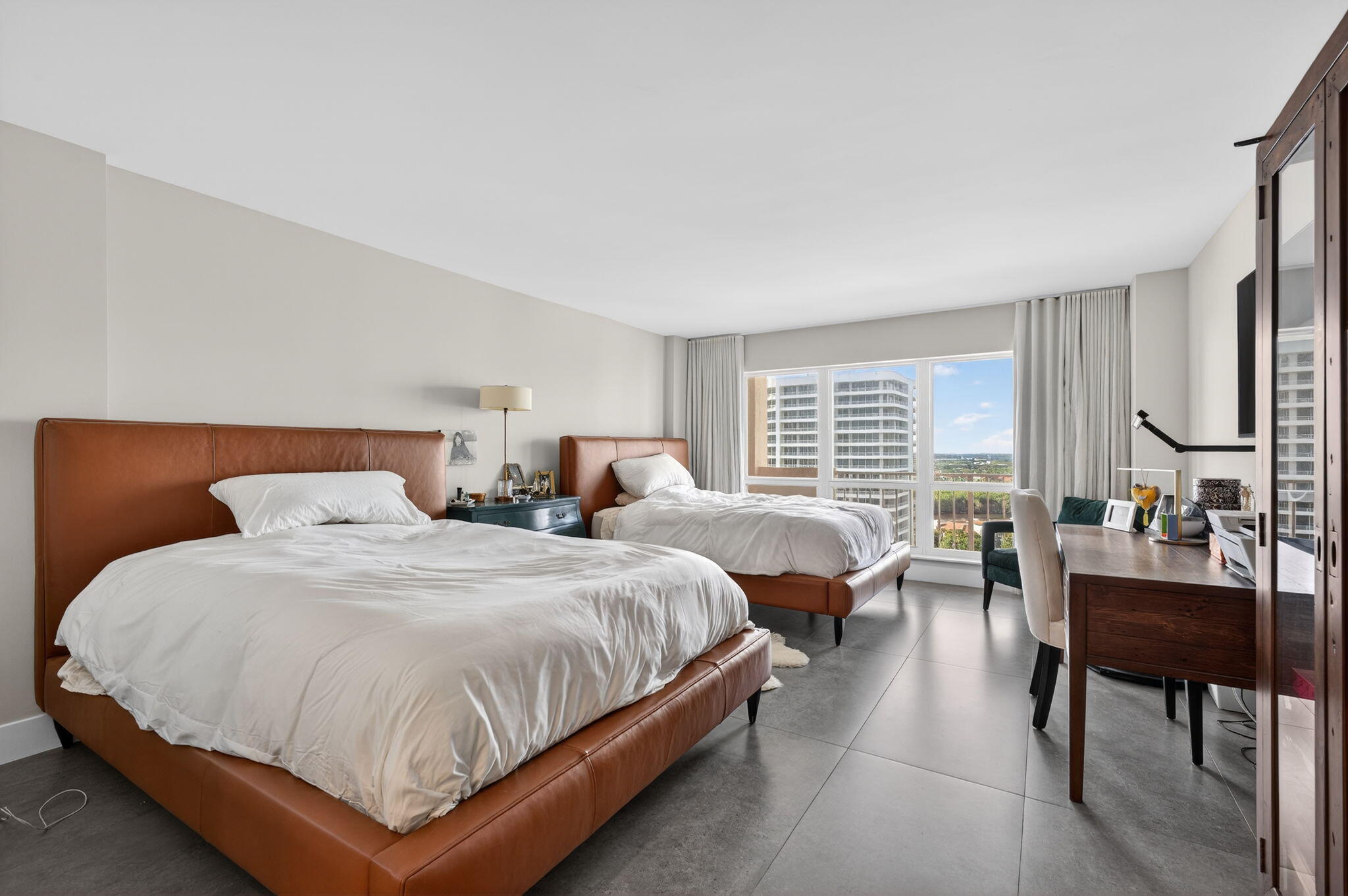 4301 North Ocean Boulevard, Unit 1206 Boca Raton, FL 33431 - Photo 28 of 71 a spacious bedroom with two beds and a couch