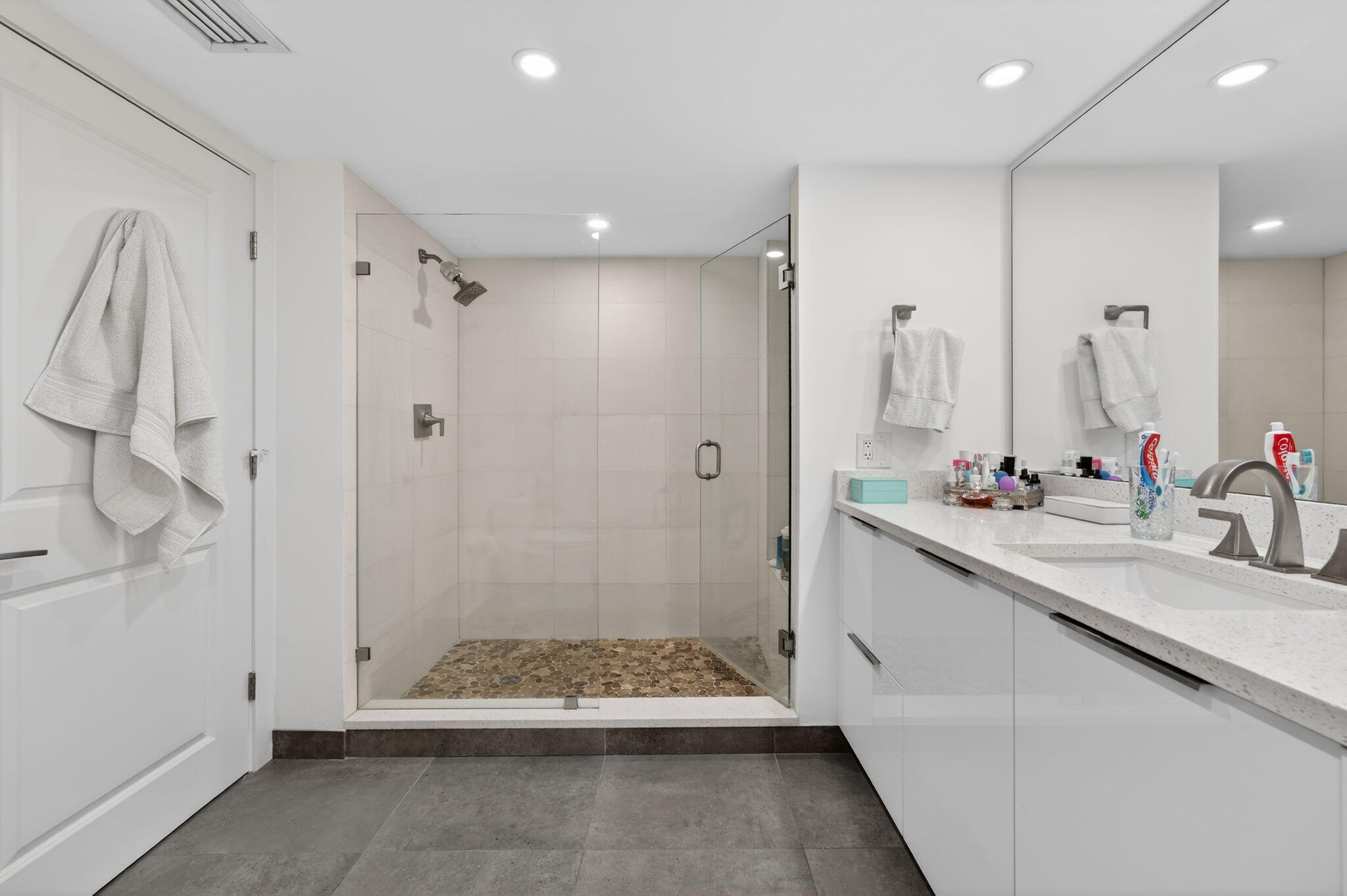 4301 North Ocean Boulevard, Unit 1206 Boca Raton, FL 33431 - Photo 33 of 71 a bathroom with a double vanity sink and mirror