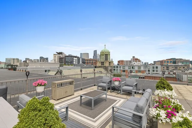 a view of city from terrace along with seating space