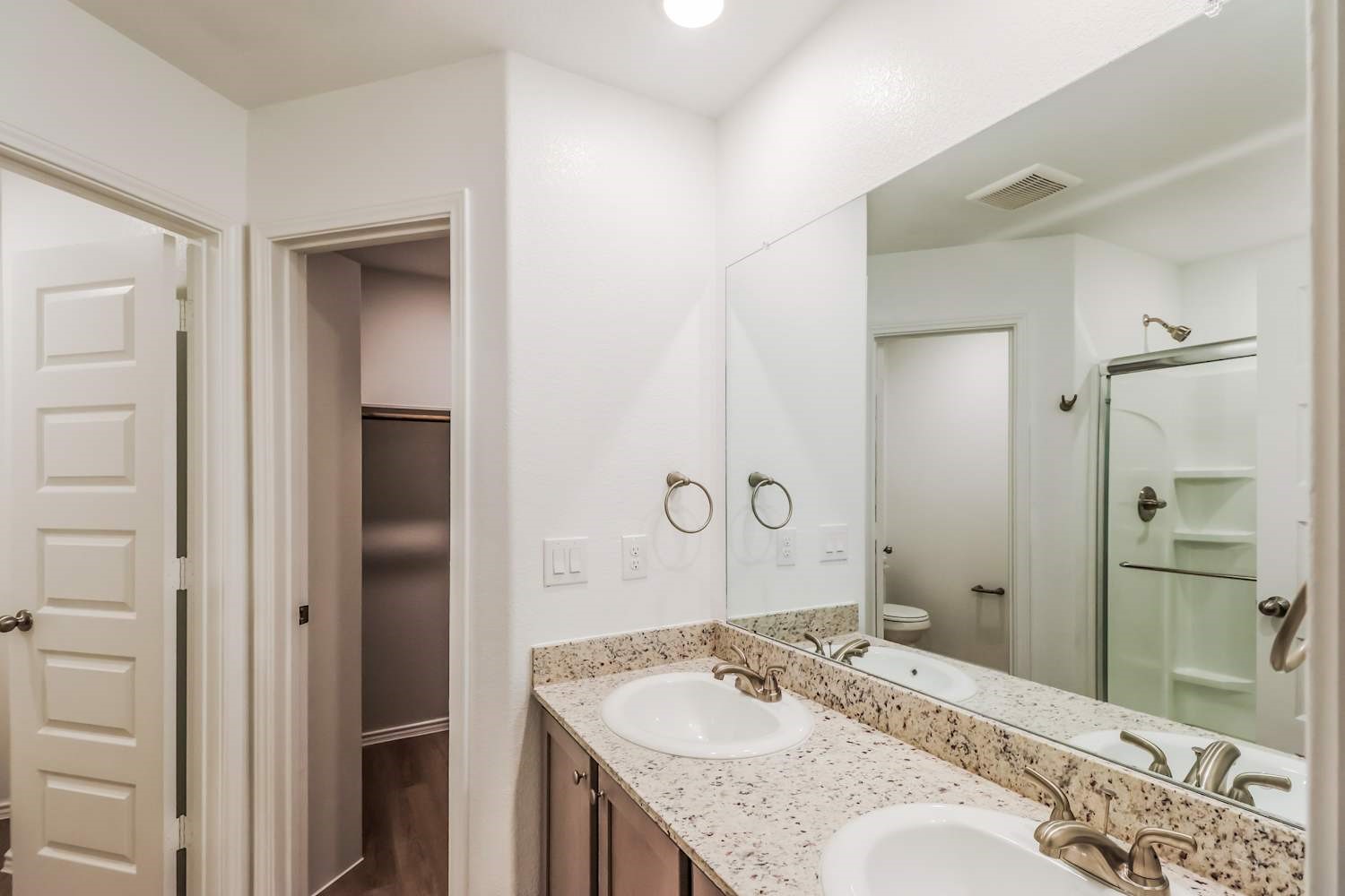 24812 Scilla Way Montgomery, TX 77316 - Photo 13 of 18 a bathroom with a granite countertop sink shower and a mirror