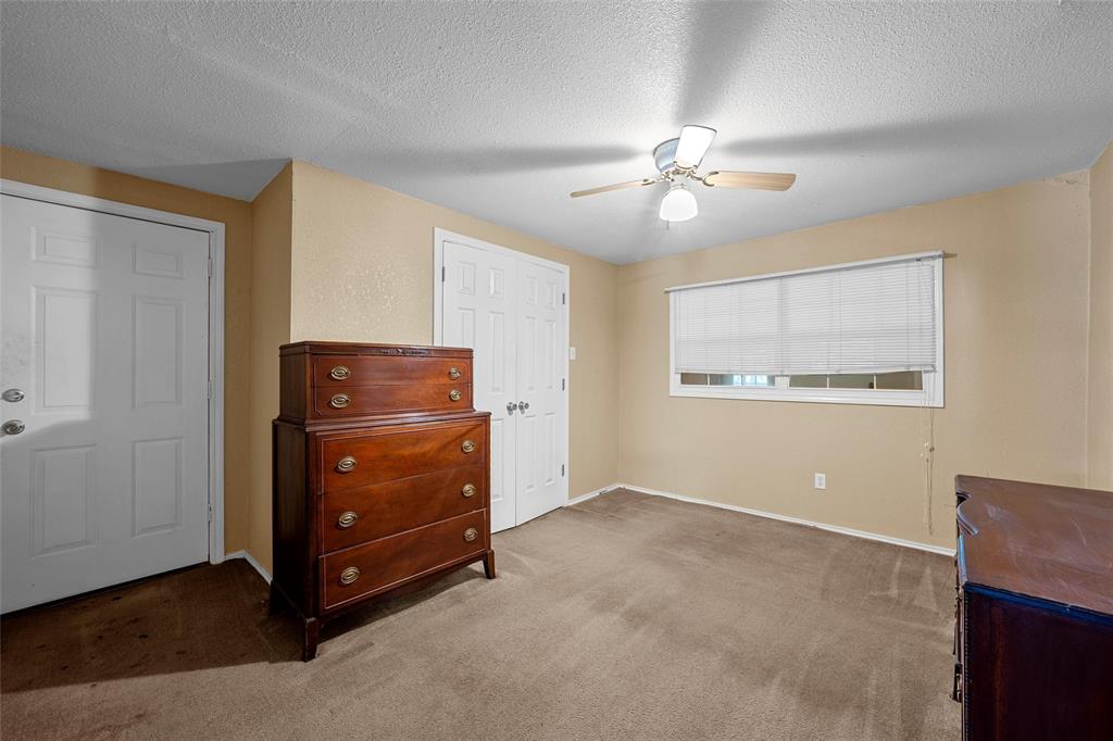 4704 Williams Road Bellmead, TX 76705 - Photo 22 of 32 Neutral-toned walls complement the carpeted flooring