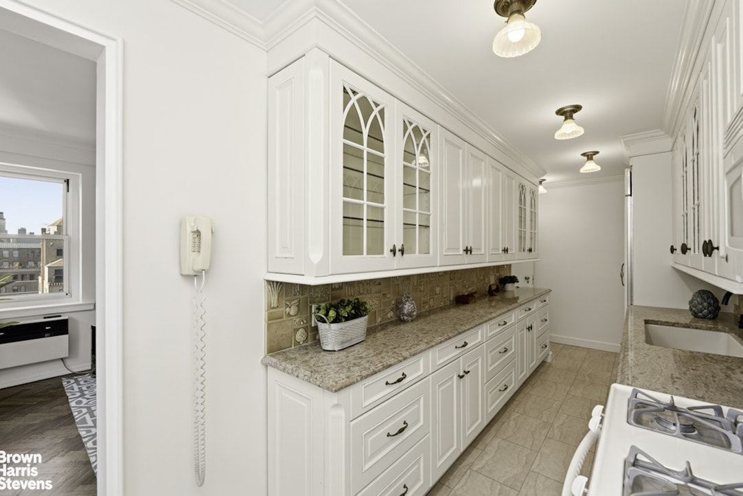 710 Park Avenue, Unit PH20B Manhattan, NY 10021 - Photo 8 of 20 a bathroom with granite countertop a sink a vanity and a large mirror